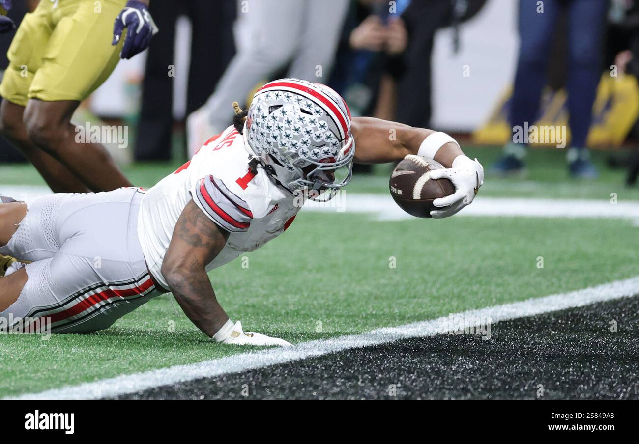 Ohio State running back Quinshon Judkins (1) stretches across the goal