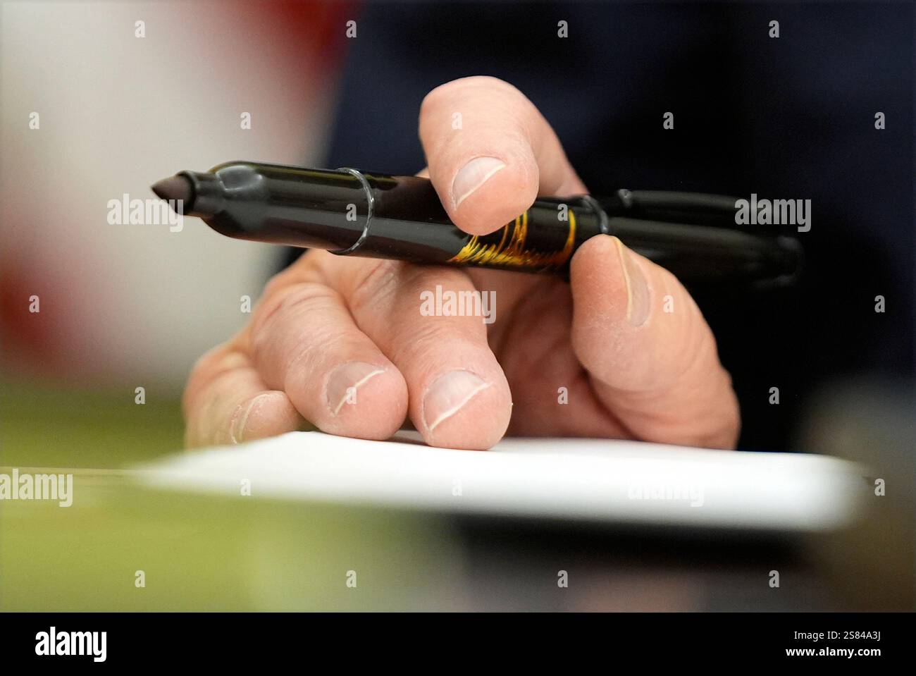 President Donald Trump signs executive orders in the Oval Office of the