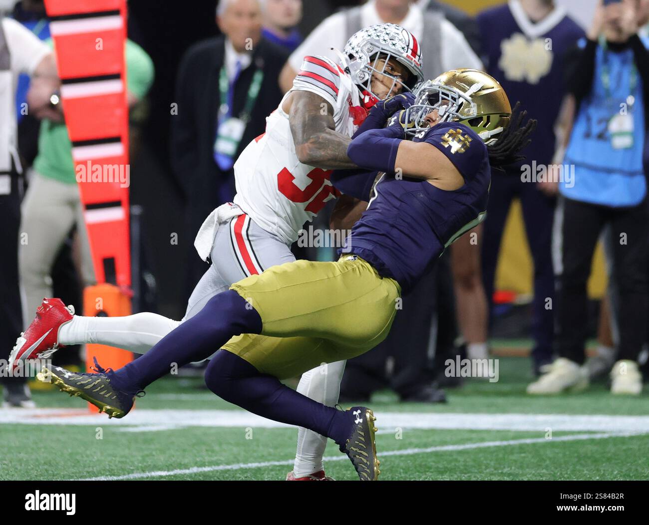 Notre Dame safety Xavier Watts (0) breaks up a pass to Ohio State