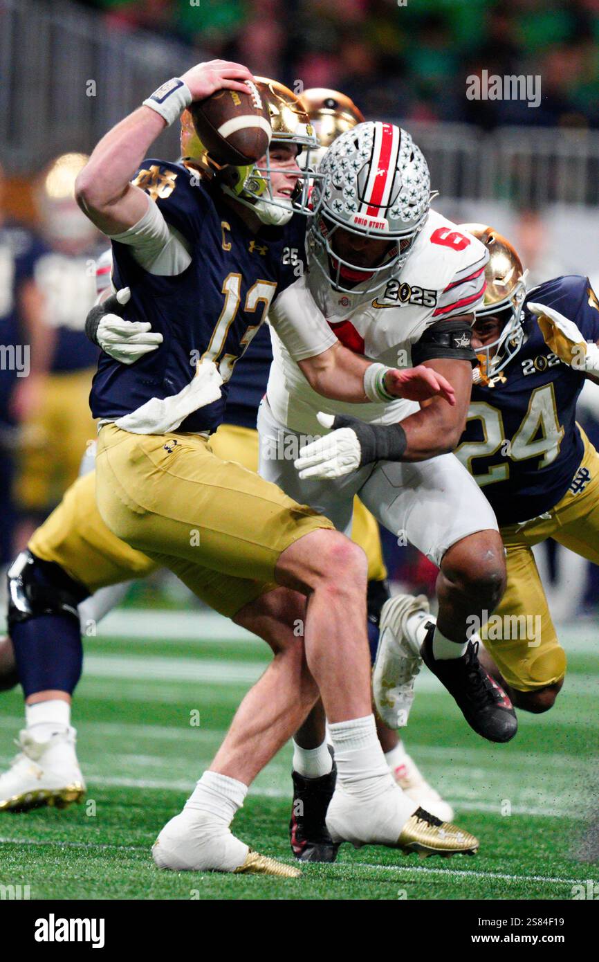 Notre Dame quarterback Riley Leonard is sacked by Ohio State safety