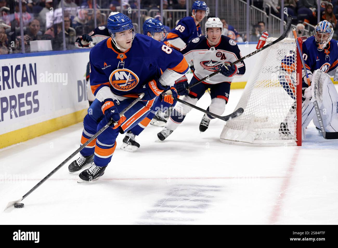 New York Islanders defenseman Noah Dobson (8) skates with the puck in