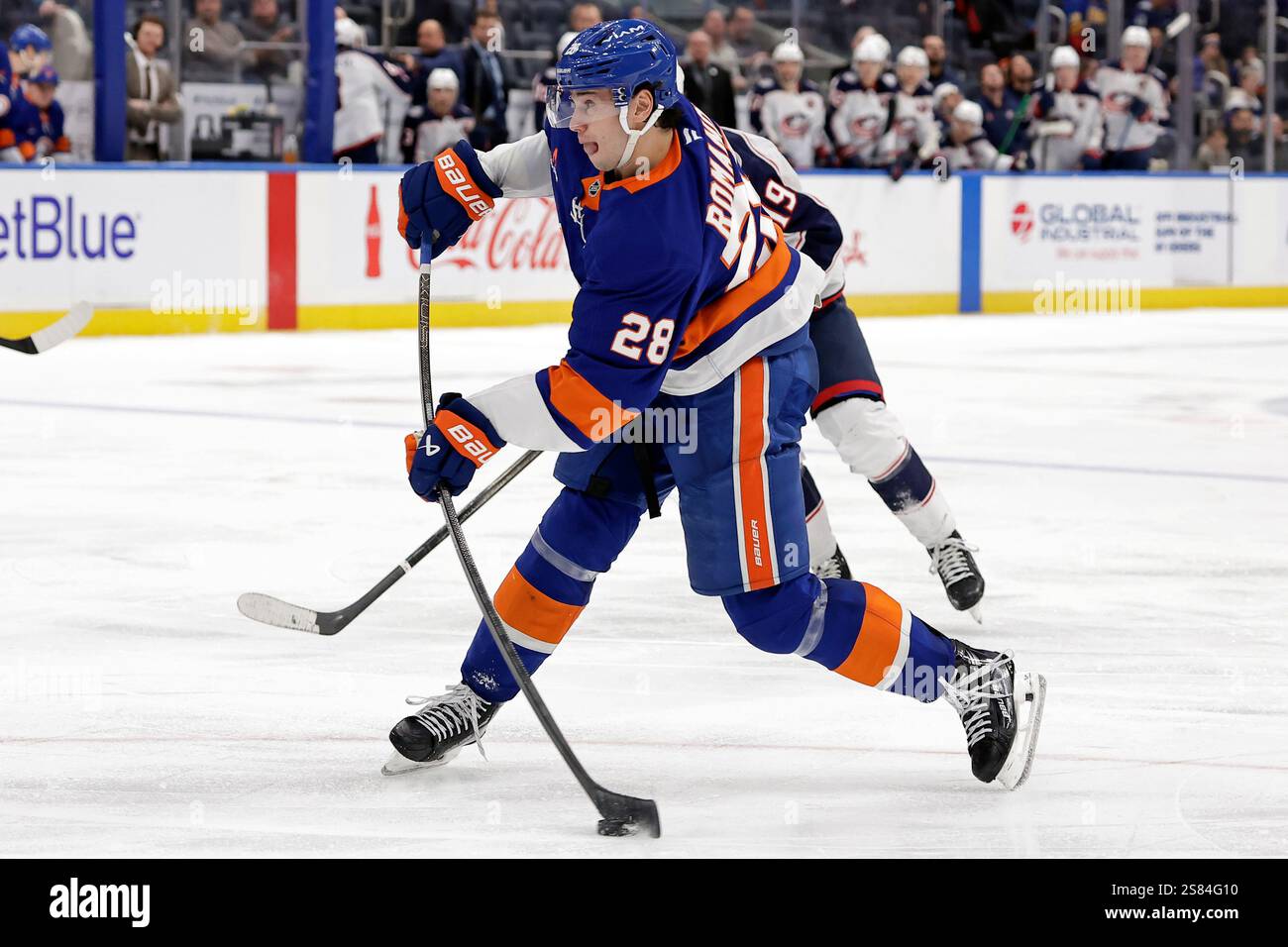New York Islanders defenseman Alexander Romanov (28) shoots the puck in