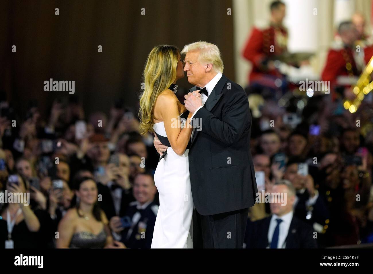 President Donald Trump, right, and first lady Melania Trump dance at