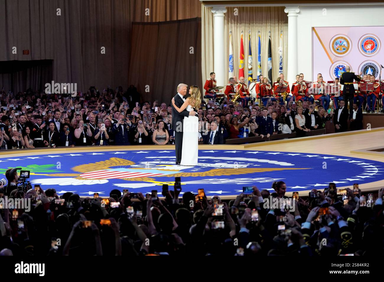 President Donald Trump, left, dances with first lady Melania Trump at