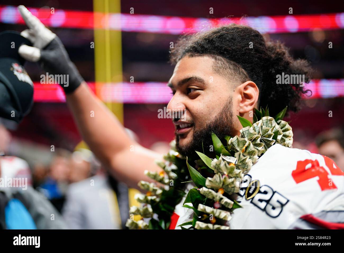 Ohio State defensive end JT Tuimoloau celebrates after their win