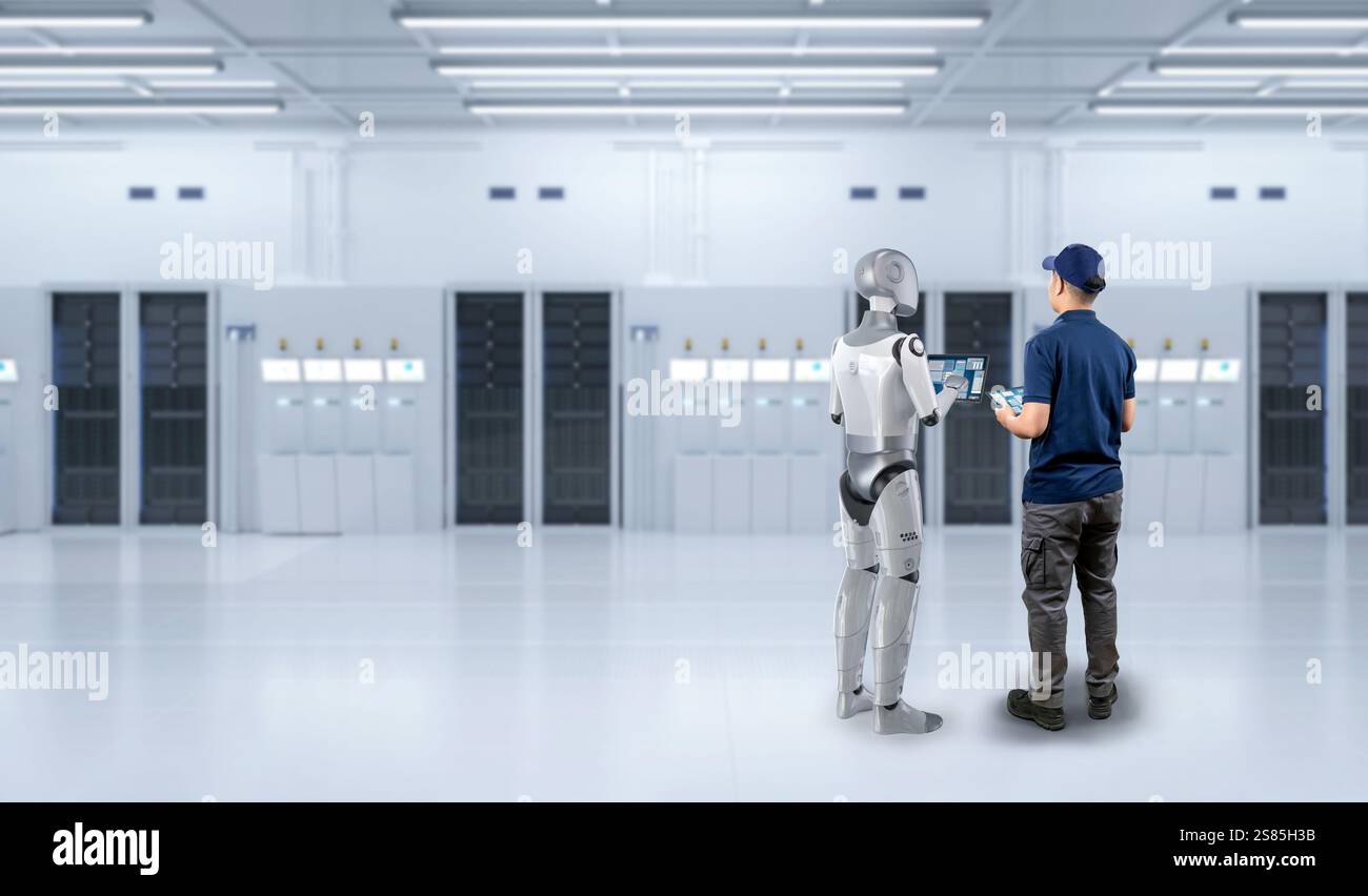 Programmer or engineer work together with assistant robot in server room Stock Photo