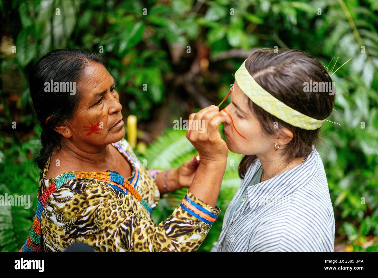 Face painting ritual, Sinchi Warmi, Amazonia, Napo Province, Ecuador ...
