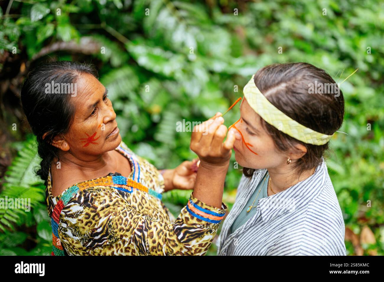 Face painting ritual, Sinchi Warmi, Amazonia, Napo Province, Ecuador ...