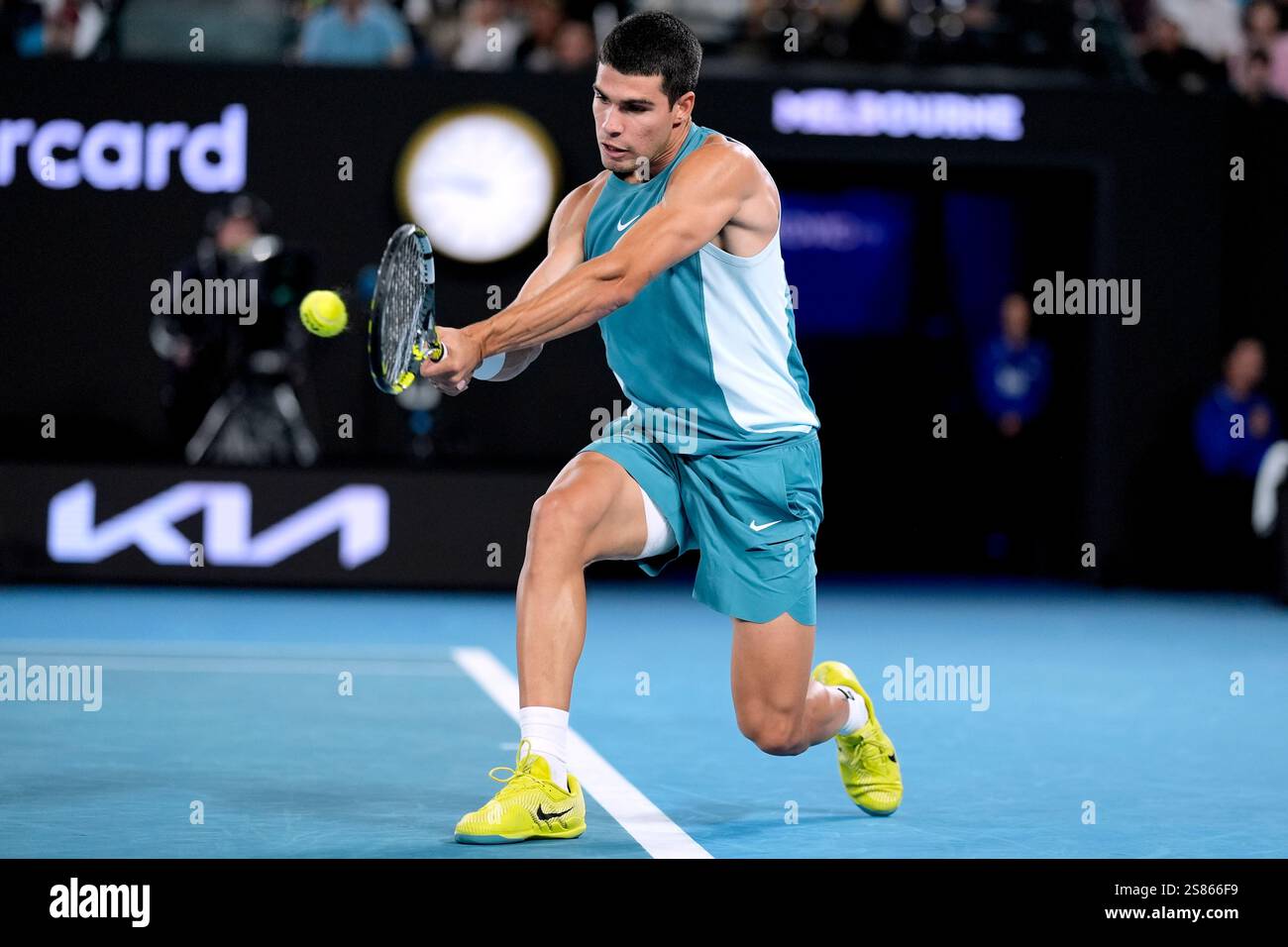 Carlos Alcaraz of Spain plays a backhand return to Novak Djokovic of