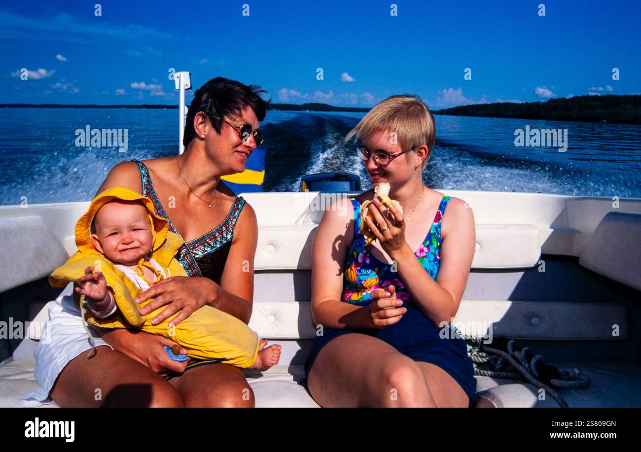 Three generations in a boat Stock Photo