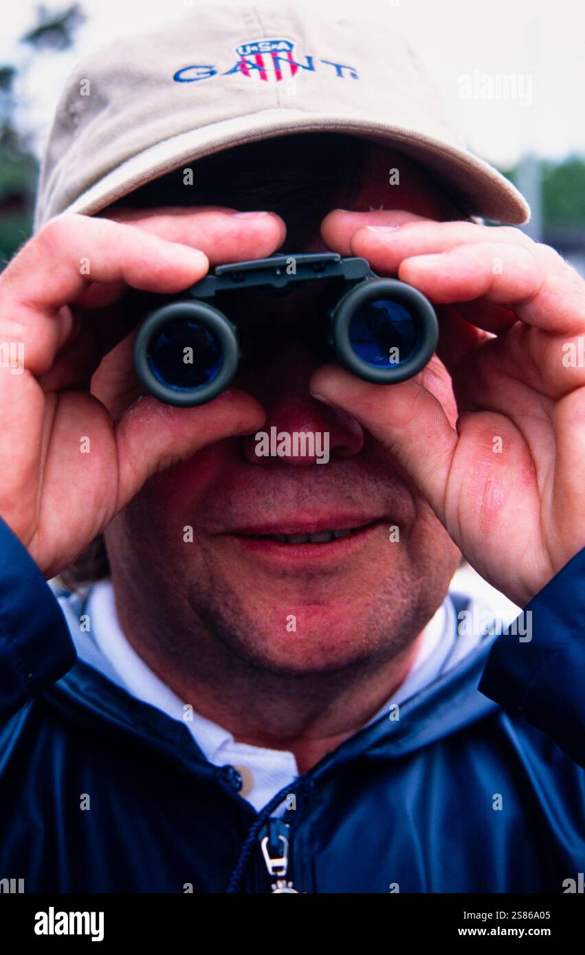 Man with binoculars Stock Photo