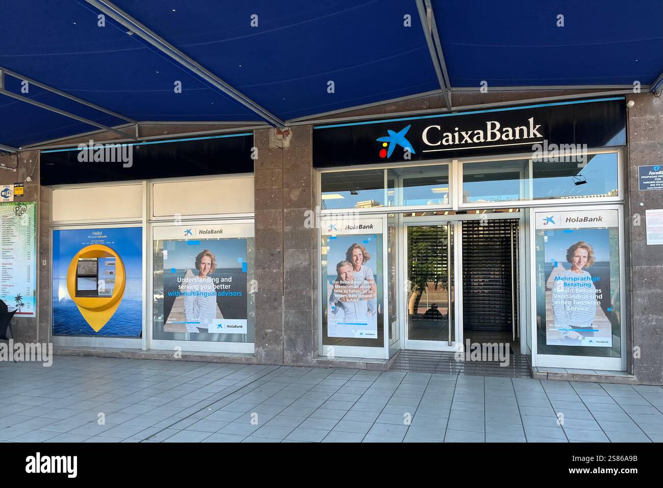 CaixaBank Branch in Costa Adeje. Tenerife, Canary Islands, Spain. 11th January 2025. - Smartphone Captured Stock Image
