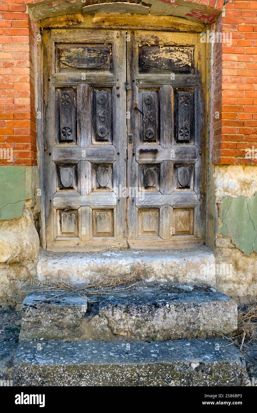 Old, disused, wooden panelled door, Monzón de Campos, Palencia Province, Castile y Leon, Spain Stock Photo
