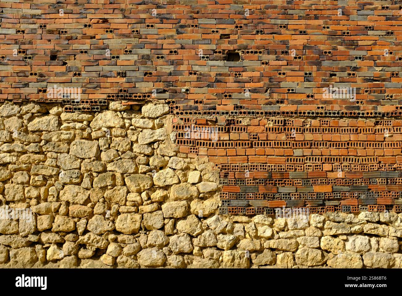 Abstract picture of a badly built brick and stone wall, Monzón de ...