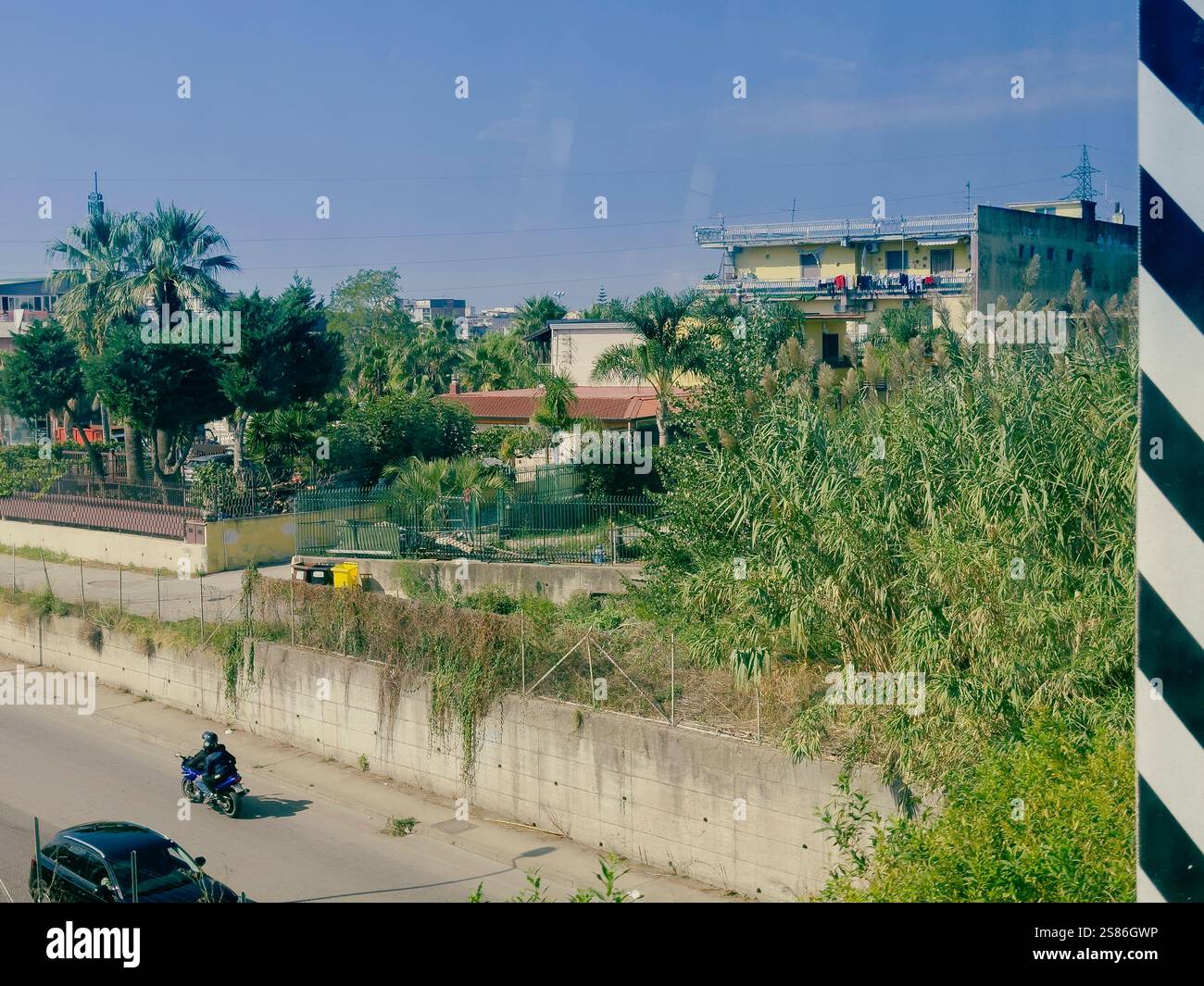 a train journey between Sorrento and Naples, Italy. As the train glides through the landscape, the scene unfolds. - Smartphone Captured Stock Image