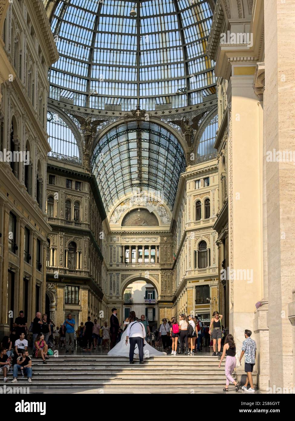 Umberto I is a historic and bustling shopping gallery in Naples, Italy, renowned for its grand architecture and vibrant atmosphere: Phillip Roberts - Smartphone Captured Stock Image