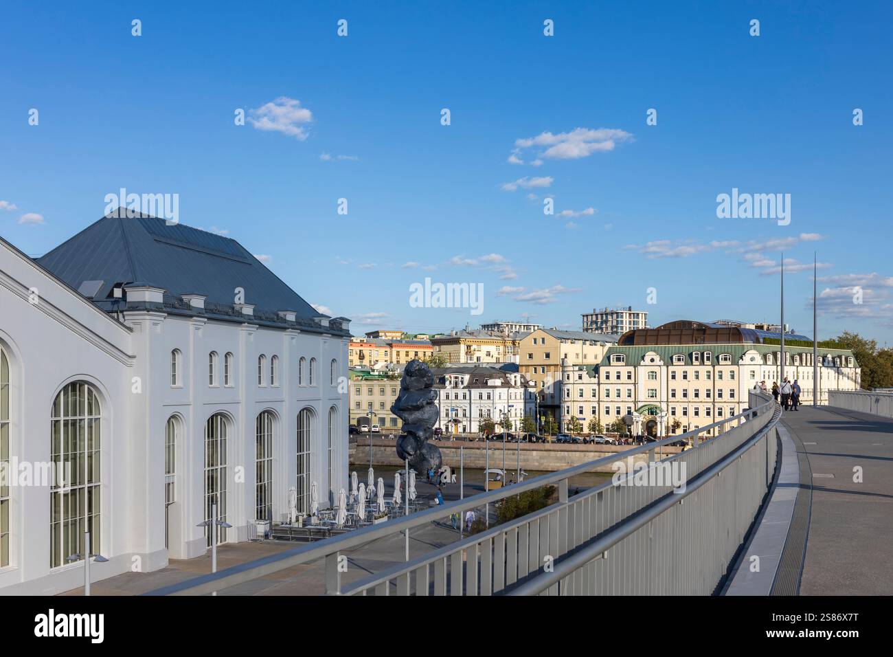 Moscow, Russia - August 24, 2024: View from the bridge of the GES-2 House of Culture, the river, and buildings on the opposite bank. Stock Photo