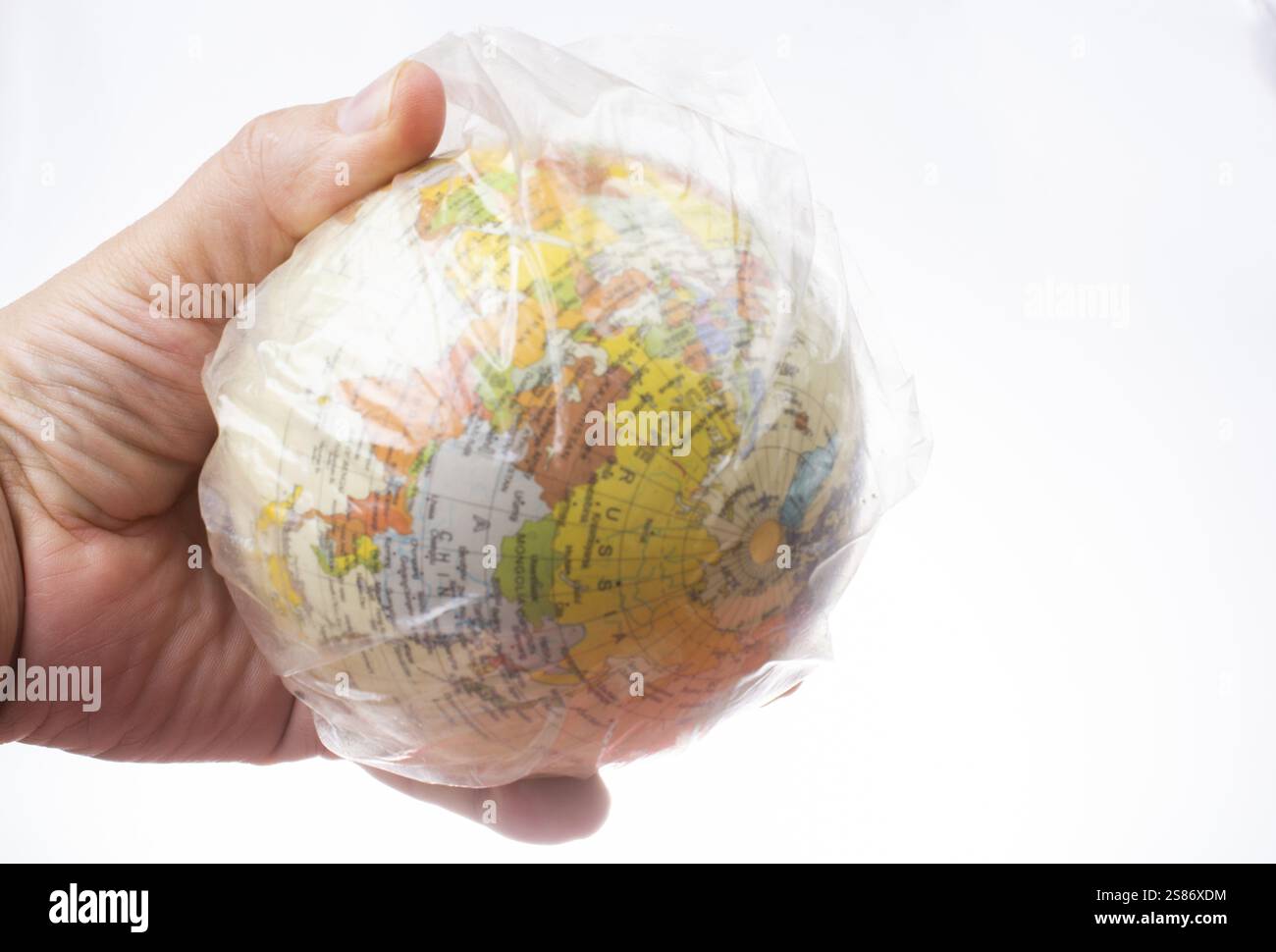 World globe in plastic bag isolated on white background Stock Photo