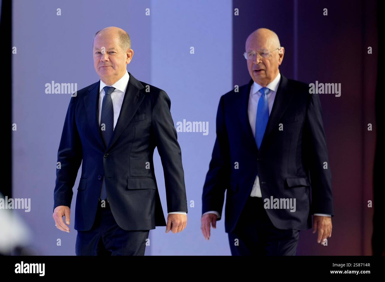 German Chancellor Olaf Scholz, left, and WEF founder Klaus Schwab