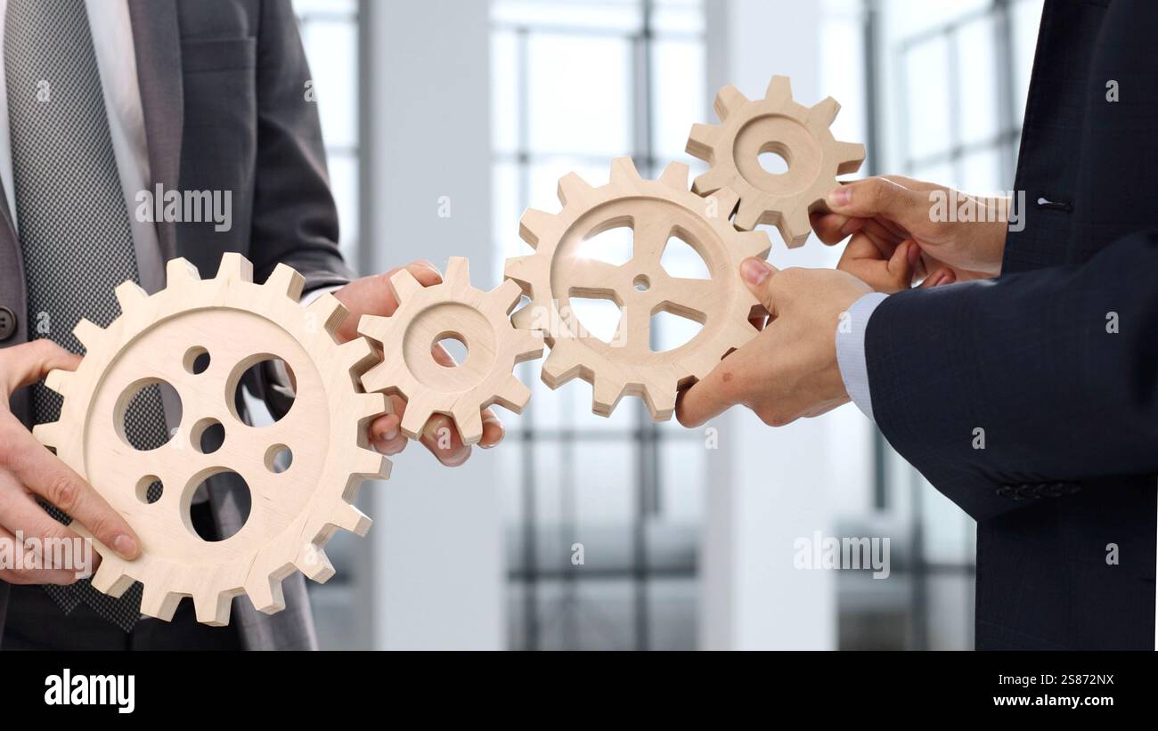 Complex Cooperation A gears, a cooperation and teamwork, complex mechanism Stock Photo - Alamy