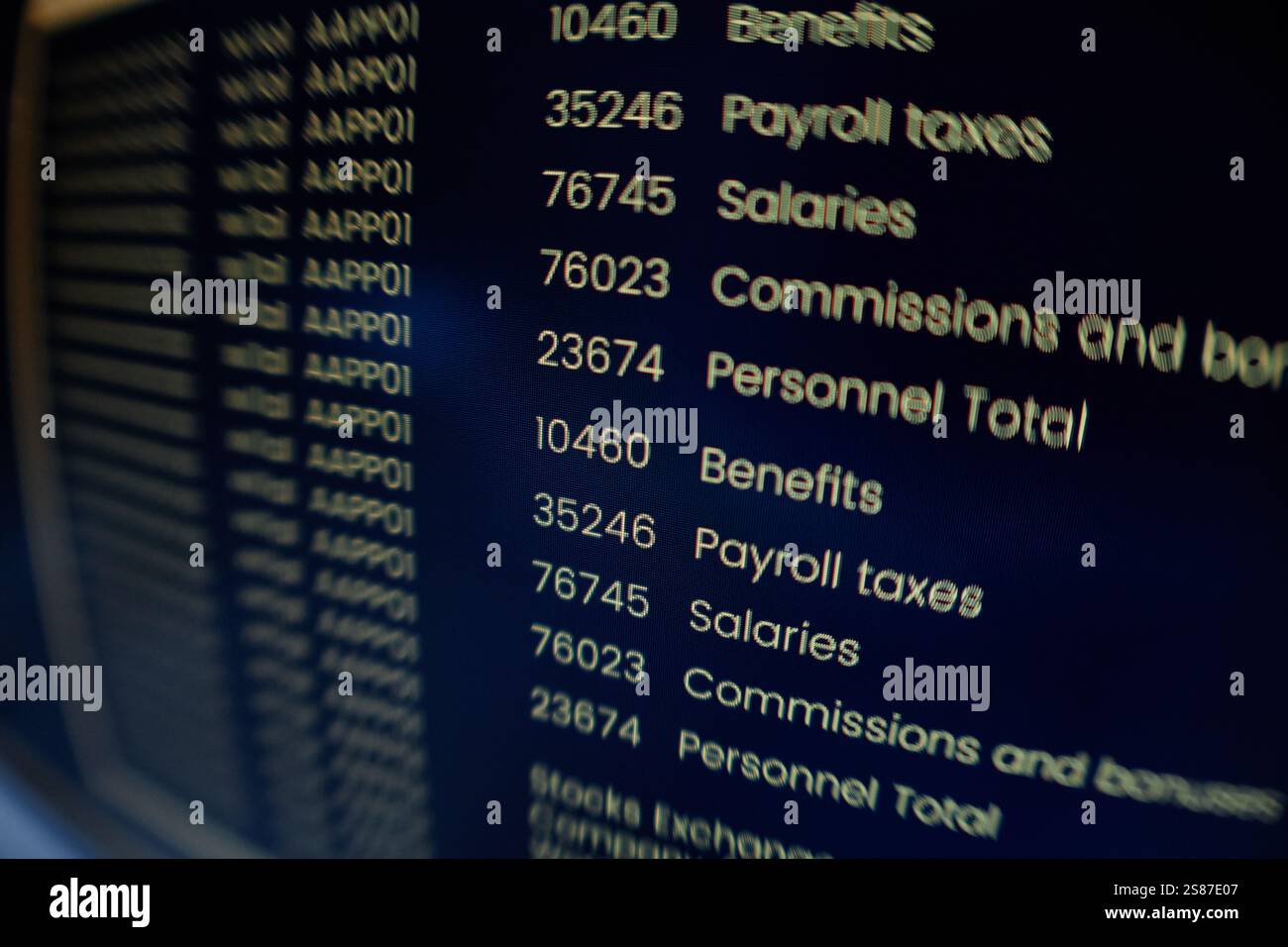 Extreme close up on computer screen displaying orange lines of coding program on black background, fish eye effect Stock Photo