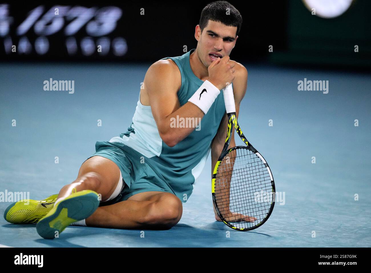 Carlos Alcaraz of Spain reacts following a fall during his quarterfinal