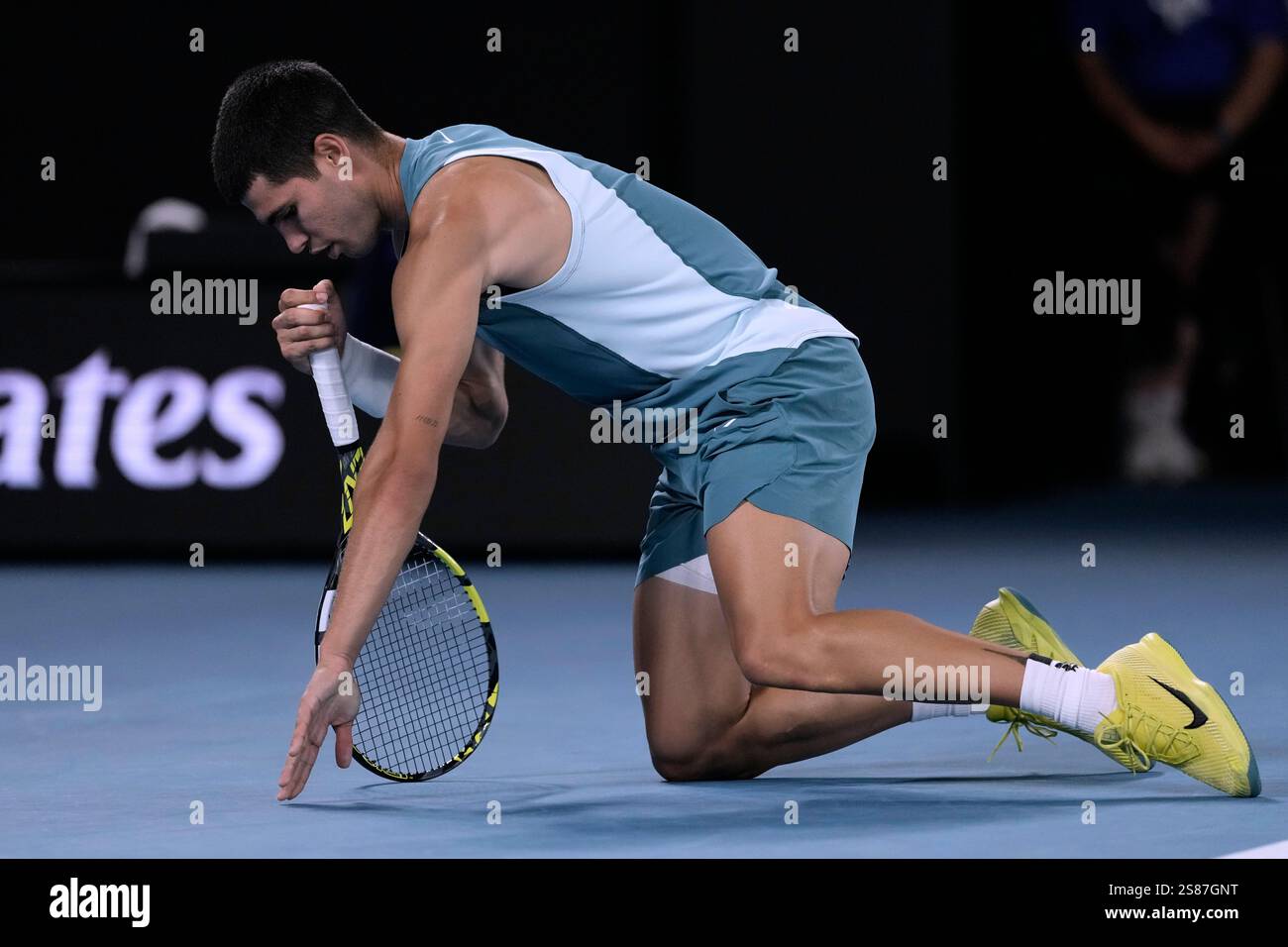 Carlos Alcaraz of Spain reacts following a fall during his quarterfinal