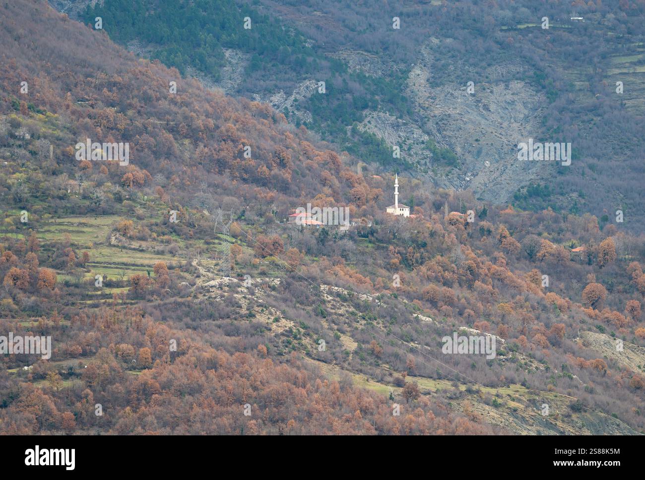 Minaret of a white mosque in the Gamti mountains, Albania Stock Photo