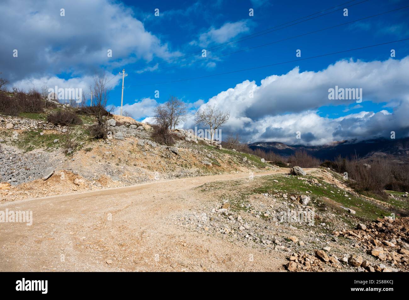 Swirling gravel road for hiking at the Gamti mountain near Bovilla lake, Albania Stock Photo
