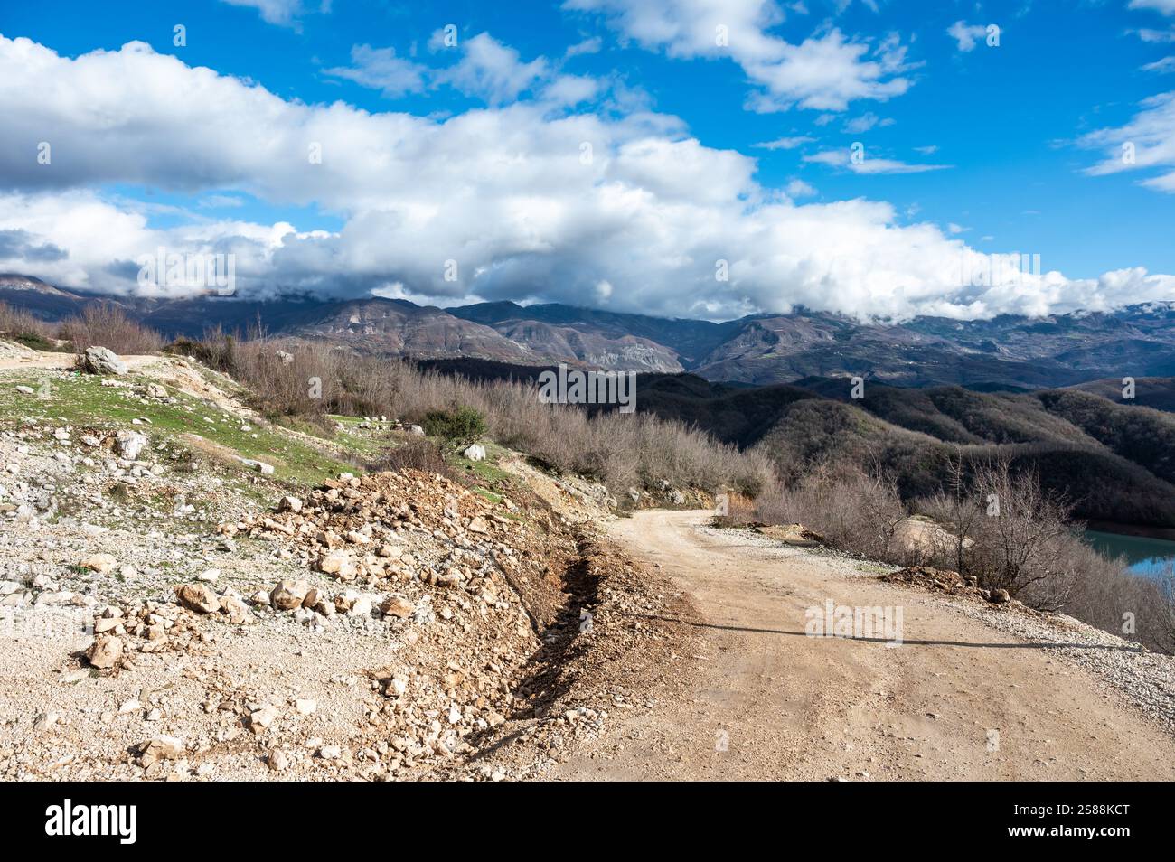 Swirling gravel road for hiking at the Gamti mountain near Bovilla lake, Albania Stock Photo