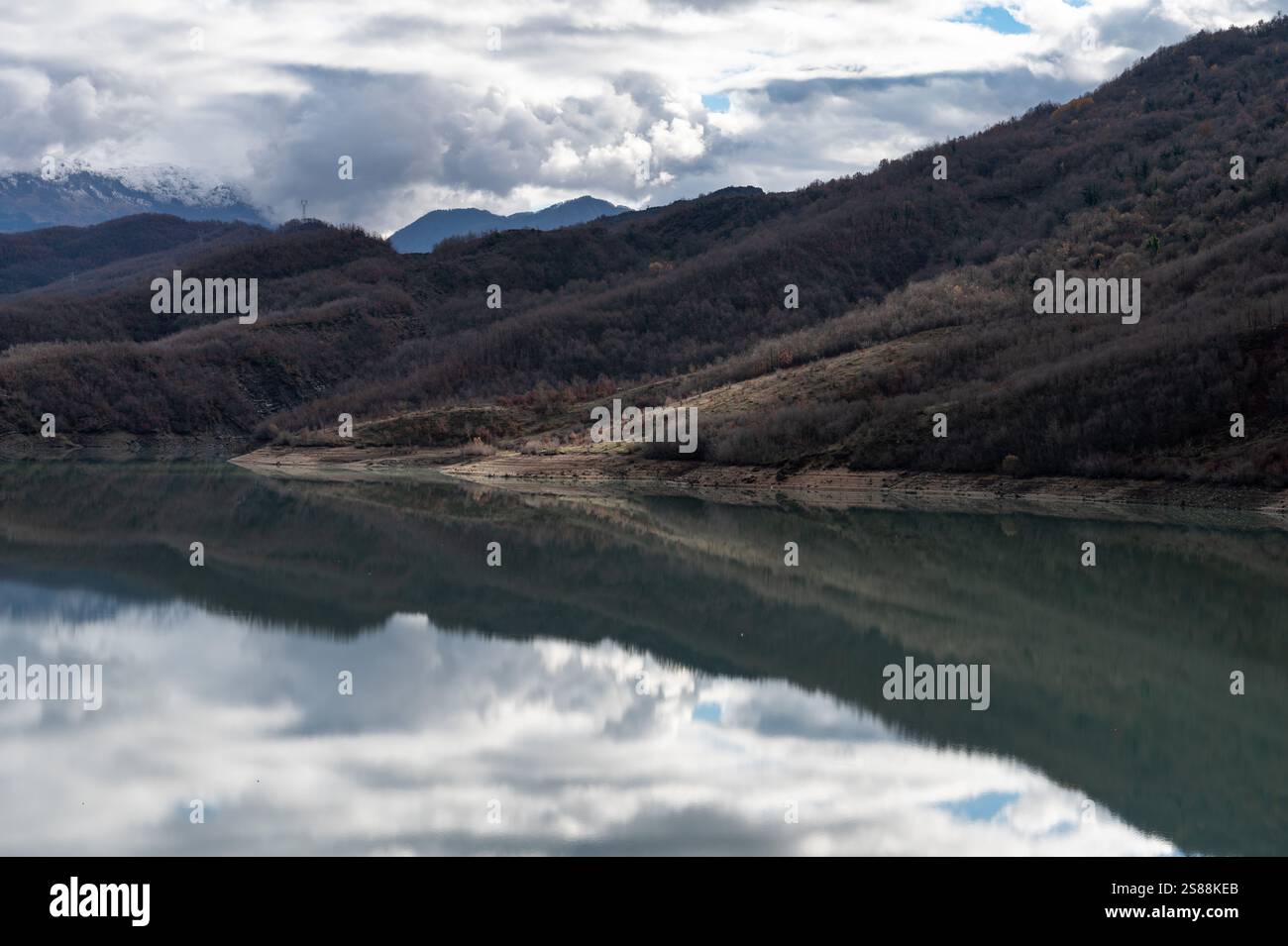 Mountain reflections with autumn colors of woods in the Boivlla lake, Albania Stock Photo