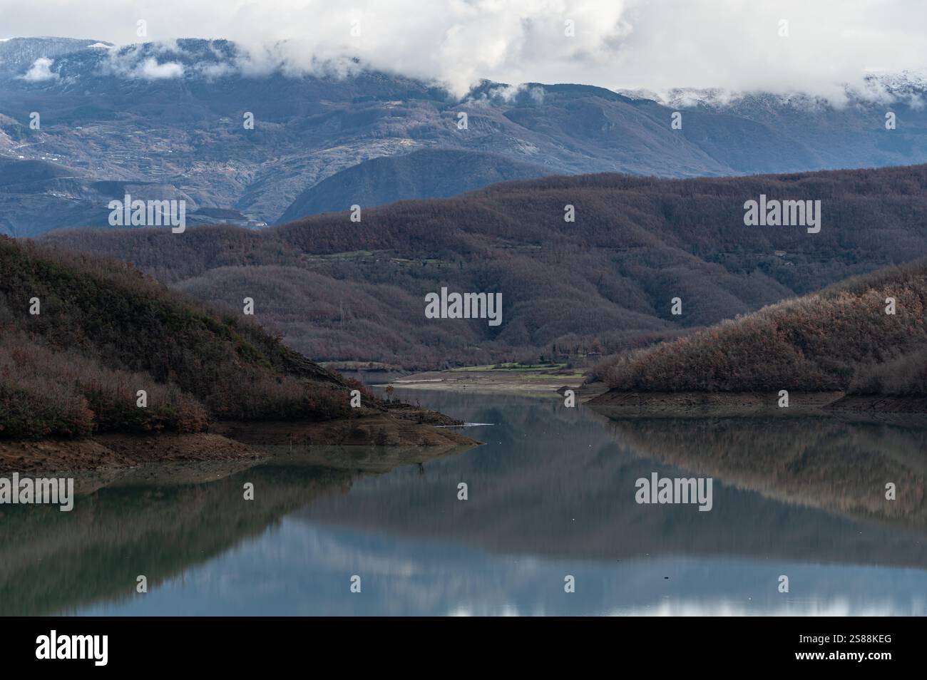 Mountain reflections with autumn colors of woods in the Boivlla lake, Albania Stock Photo
