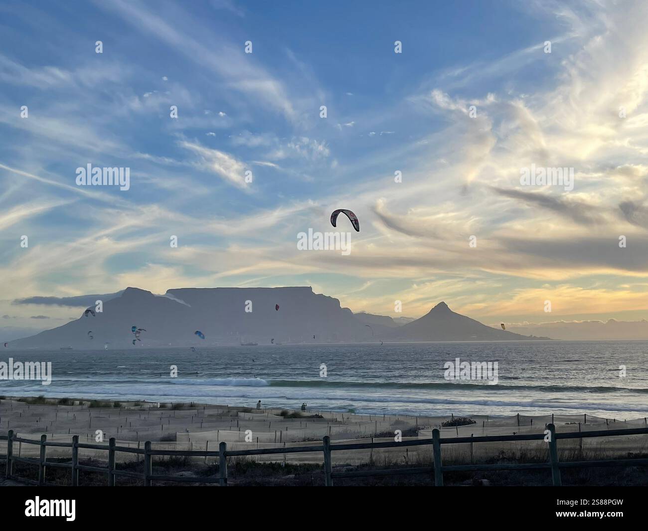 Table Mountain background, blue hour landscape just before sunset, view from Bloubergstrand beach showing dune rehabilitation in the foreground - Smartphone Captured Stock Image