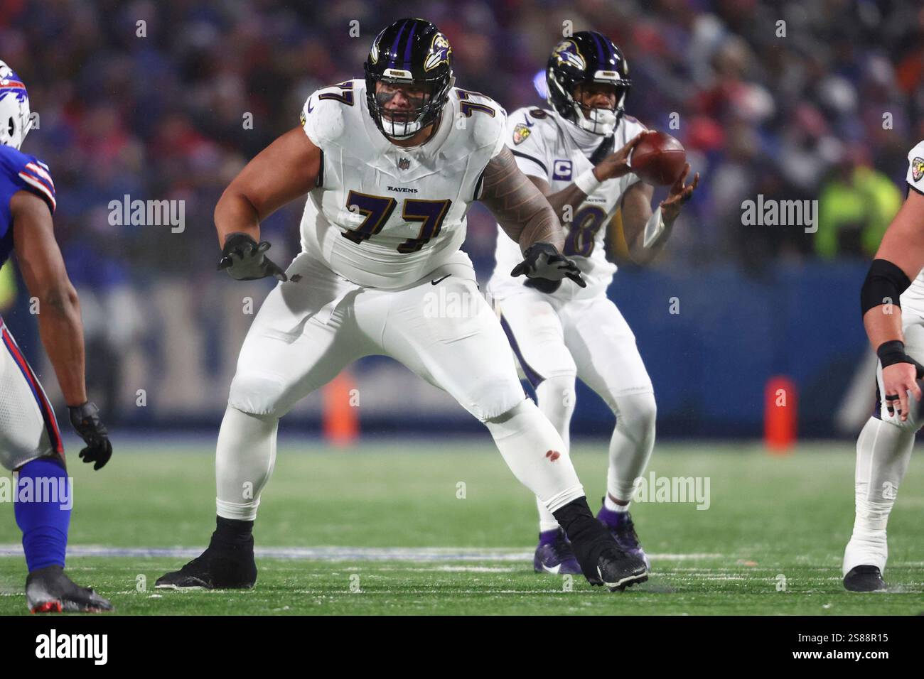 Baltimore Ravens offensive tackle Daniel Faalele (77) looks to block ...