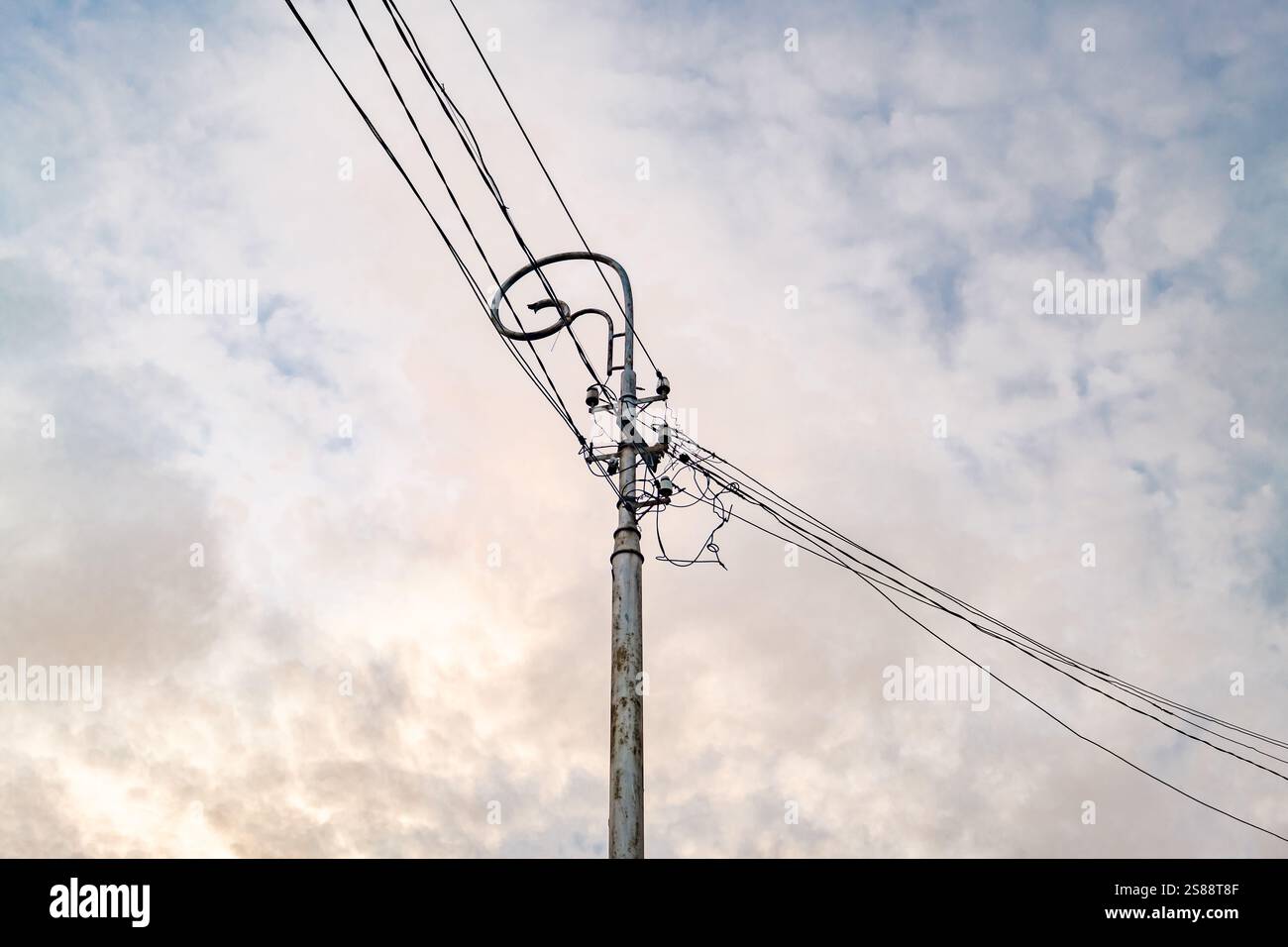 electrical wires on an old metal pole Stock Photo - Alamy