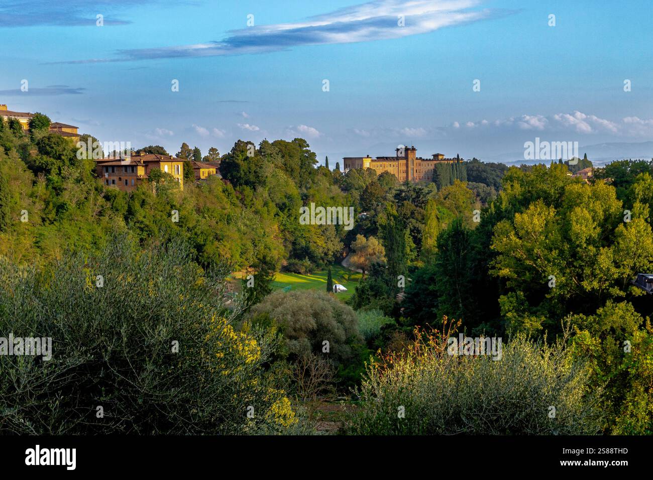A beautiful green valley in the heart of the medieval town of Sienain Tuscany, Italy Stock Photo