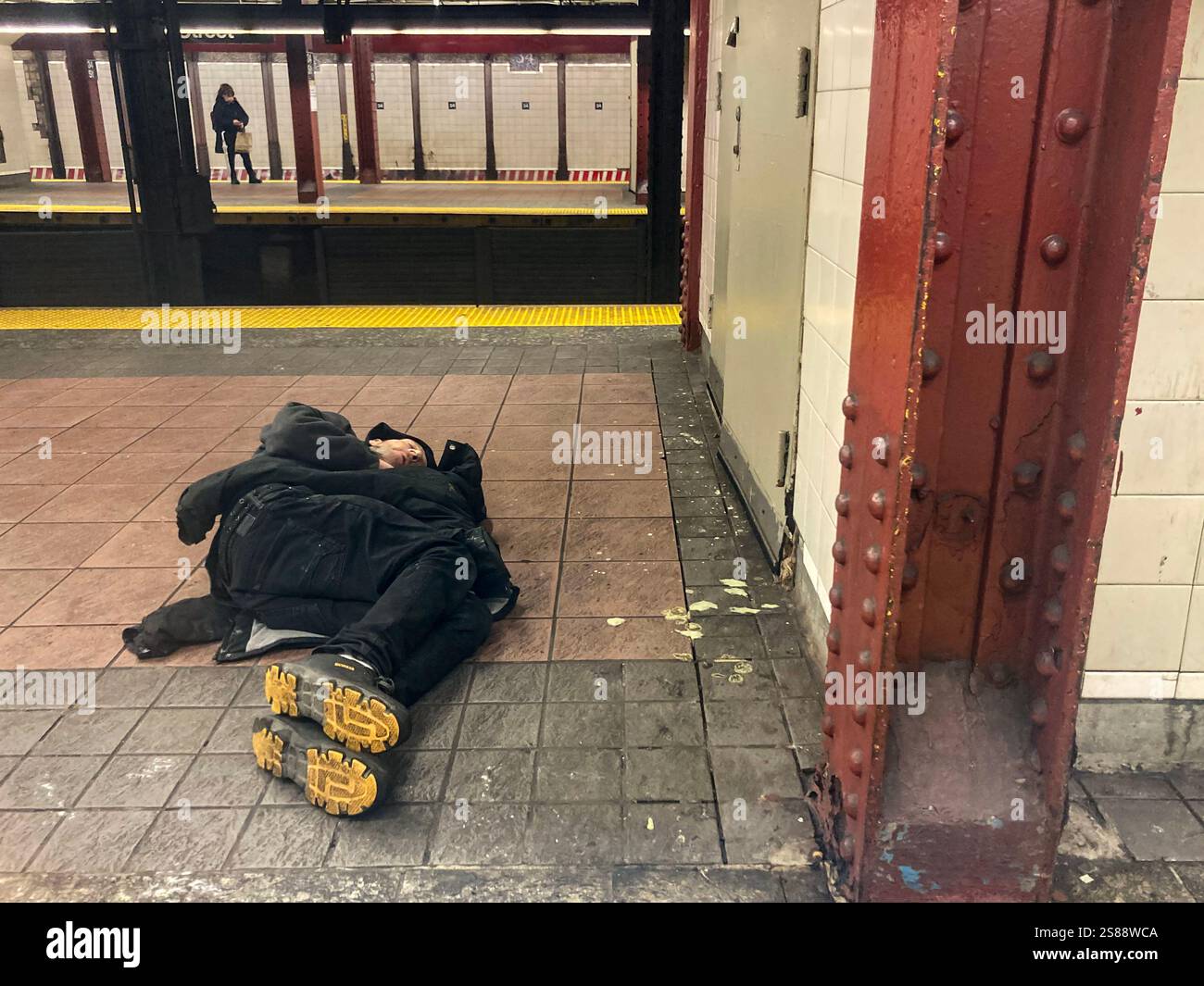 Homeless man asleep in a subway station in New York on Sunday, January ...