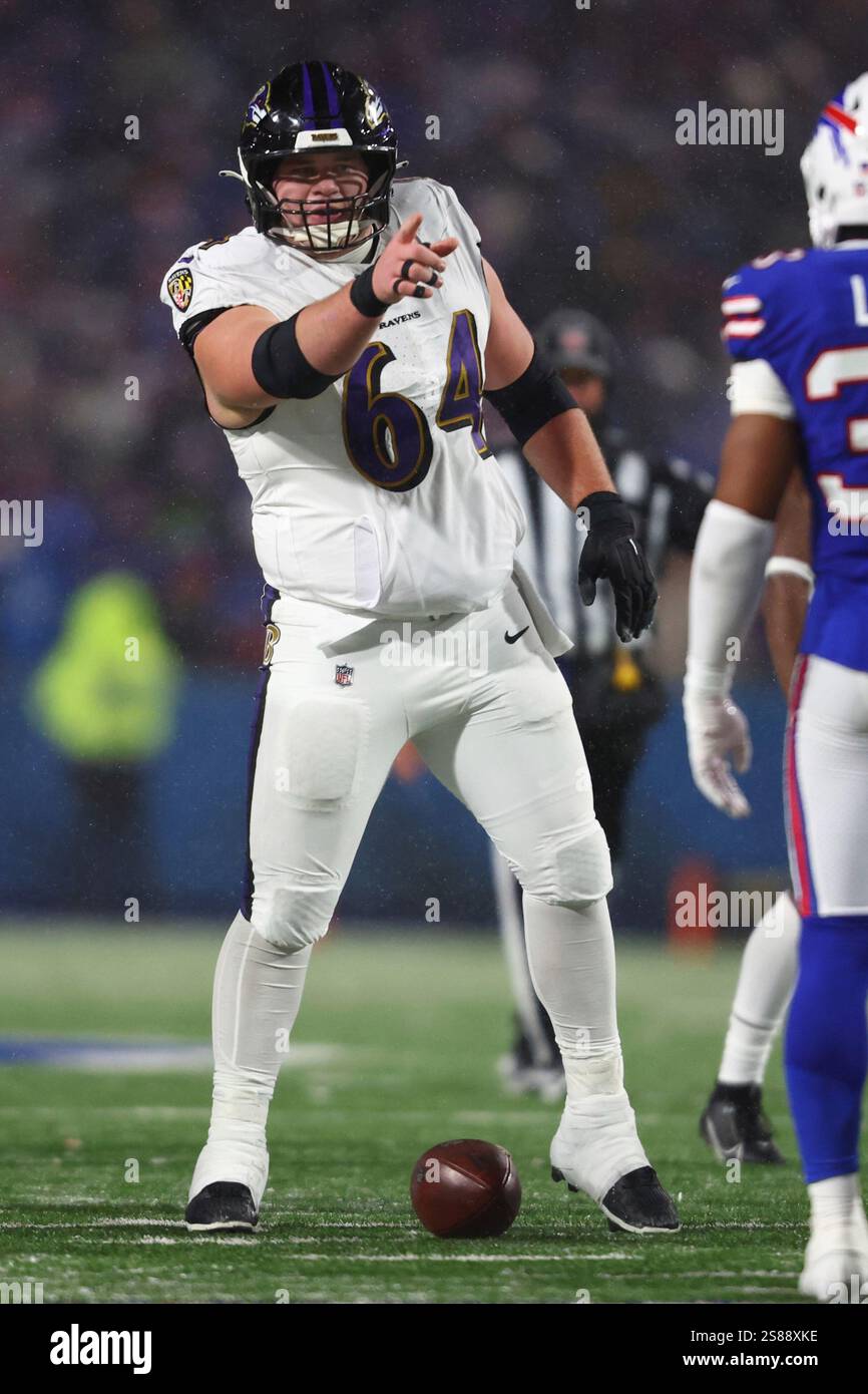 Baltimore Ravens center Tyler Linderbaum (64) points during the second ...