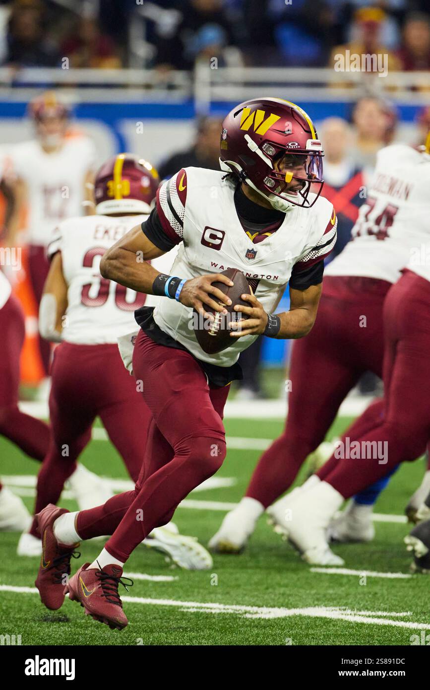 Washington Commanders quarterback Jayden Daniels (5) rushes against the