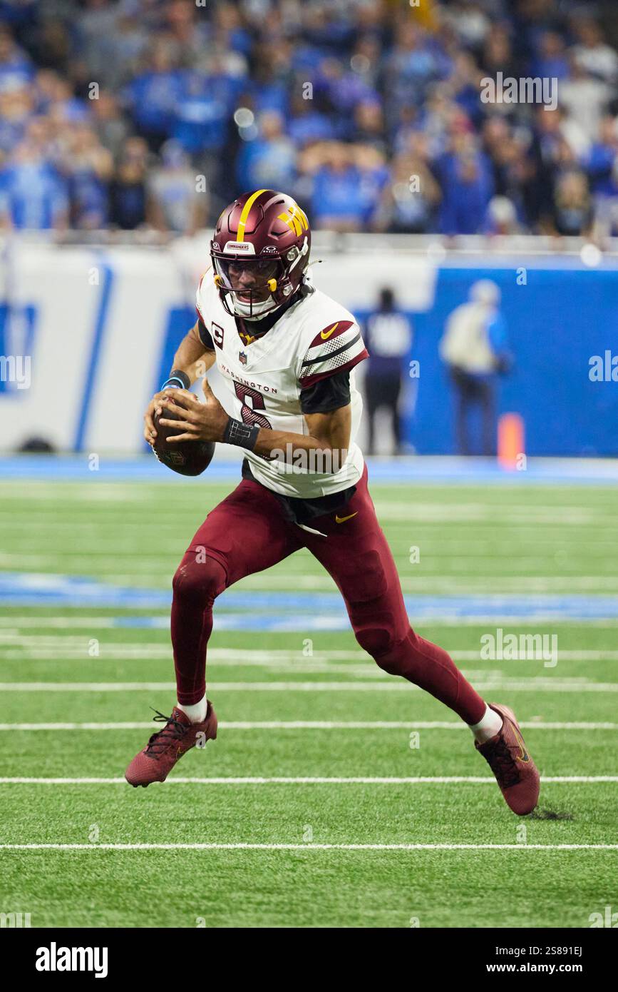 Washington Commanders quarterback Jayden Daniels (5) rushes against the
