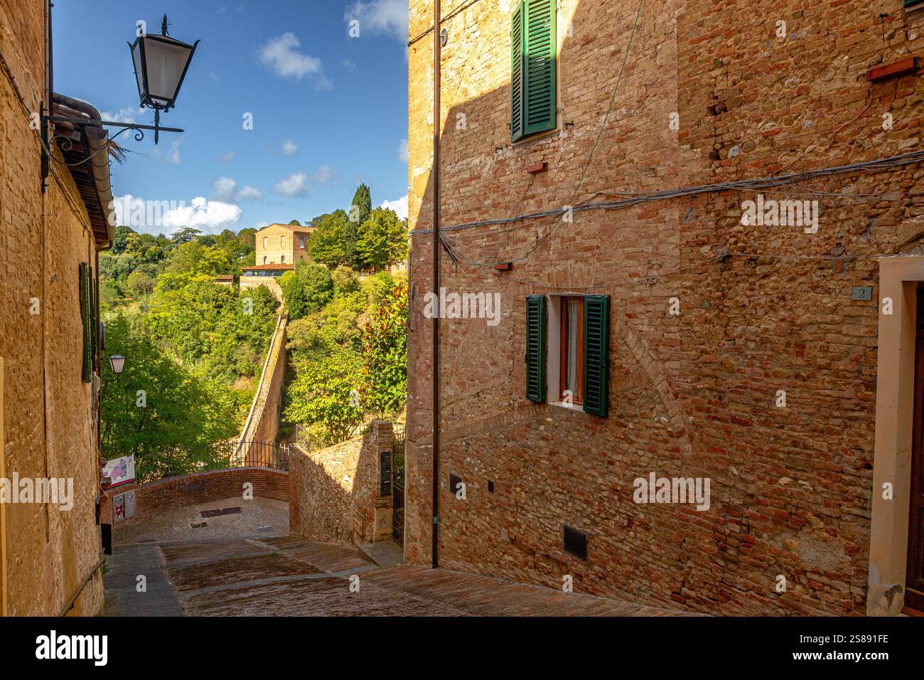 Via del Costone a narrow steep street in Siena, Italy Stock Photo