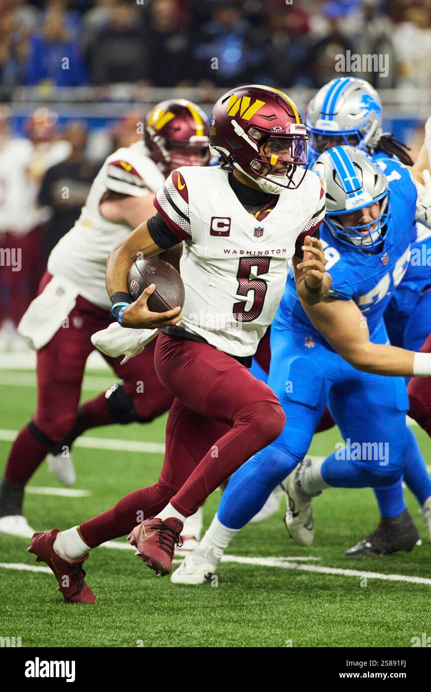 Washington Commanders quarterback Jayden Daniels (5) rushes against the