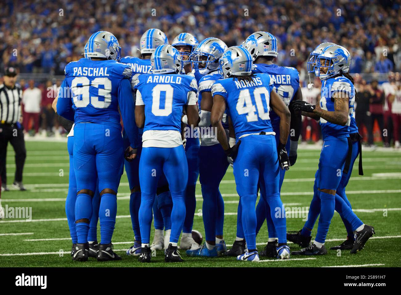 Detroit Lions huddle up on defense during an NFL football divisional