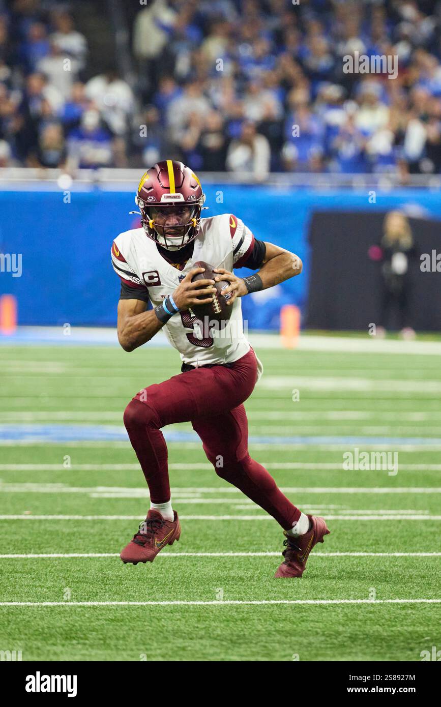 Washington Commanders quarterback Jayden Daniels (5) rushes against the