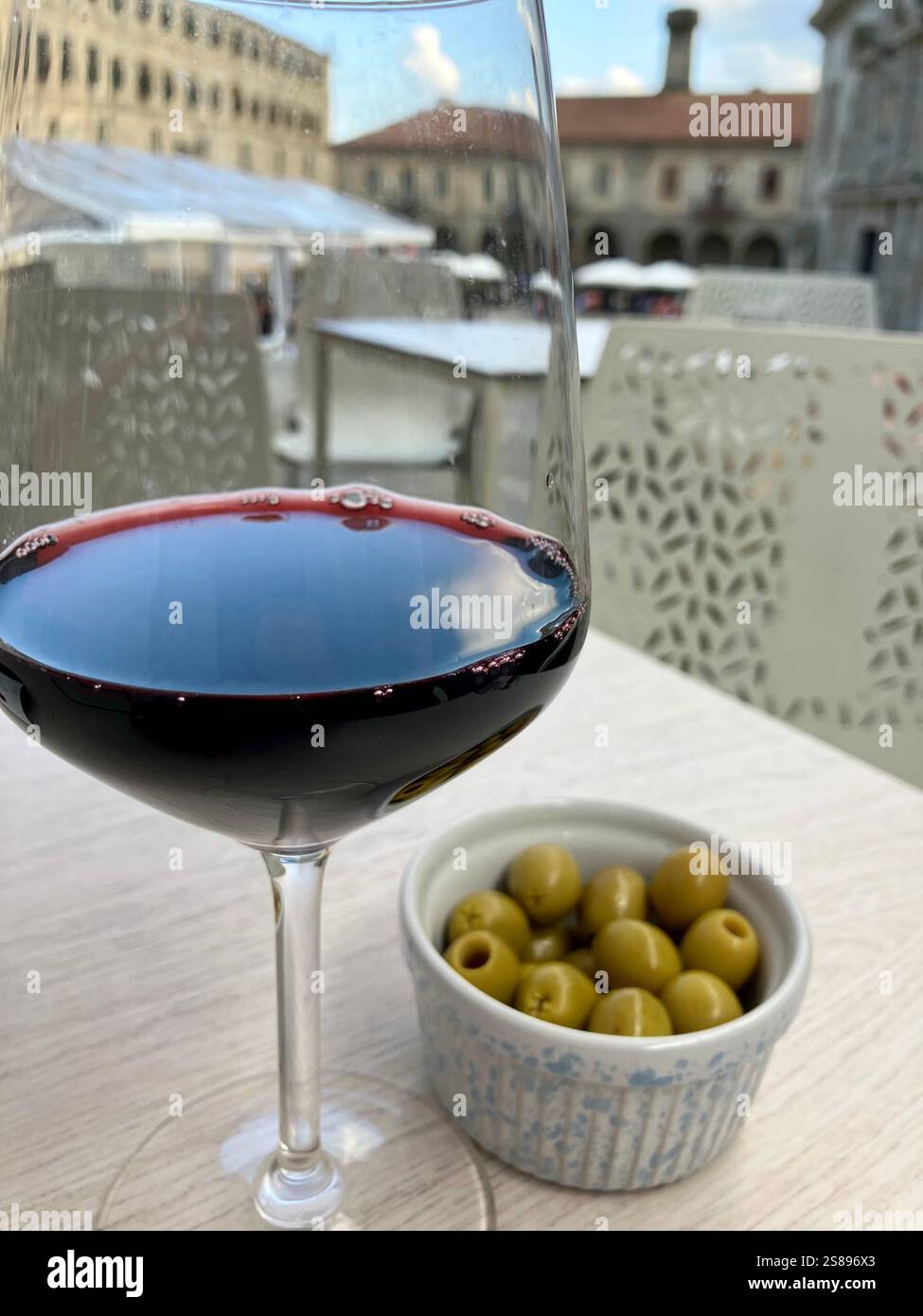 Red Wine and Olives Sat Outside a Bar in Spain - Smartphone Captured Stock Image