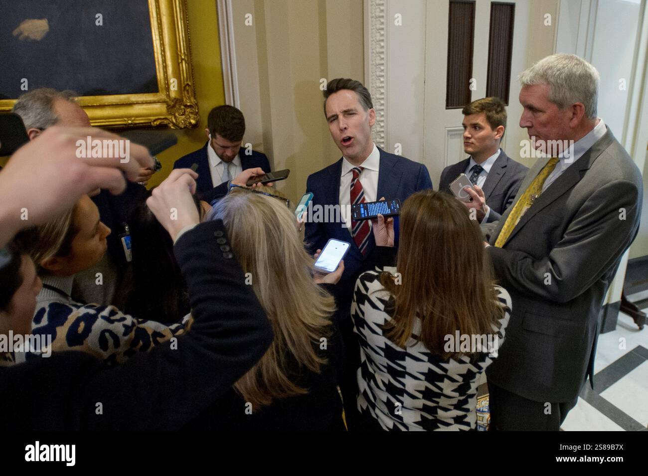 Republican Reporters Sen. Josh Hawley, R-Mo., talks with reporters as he walks to the Senate ...