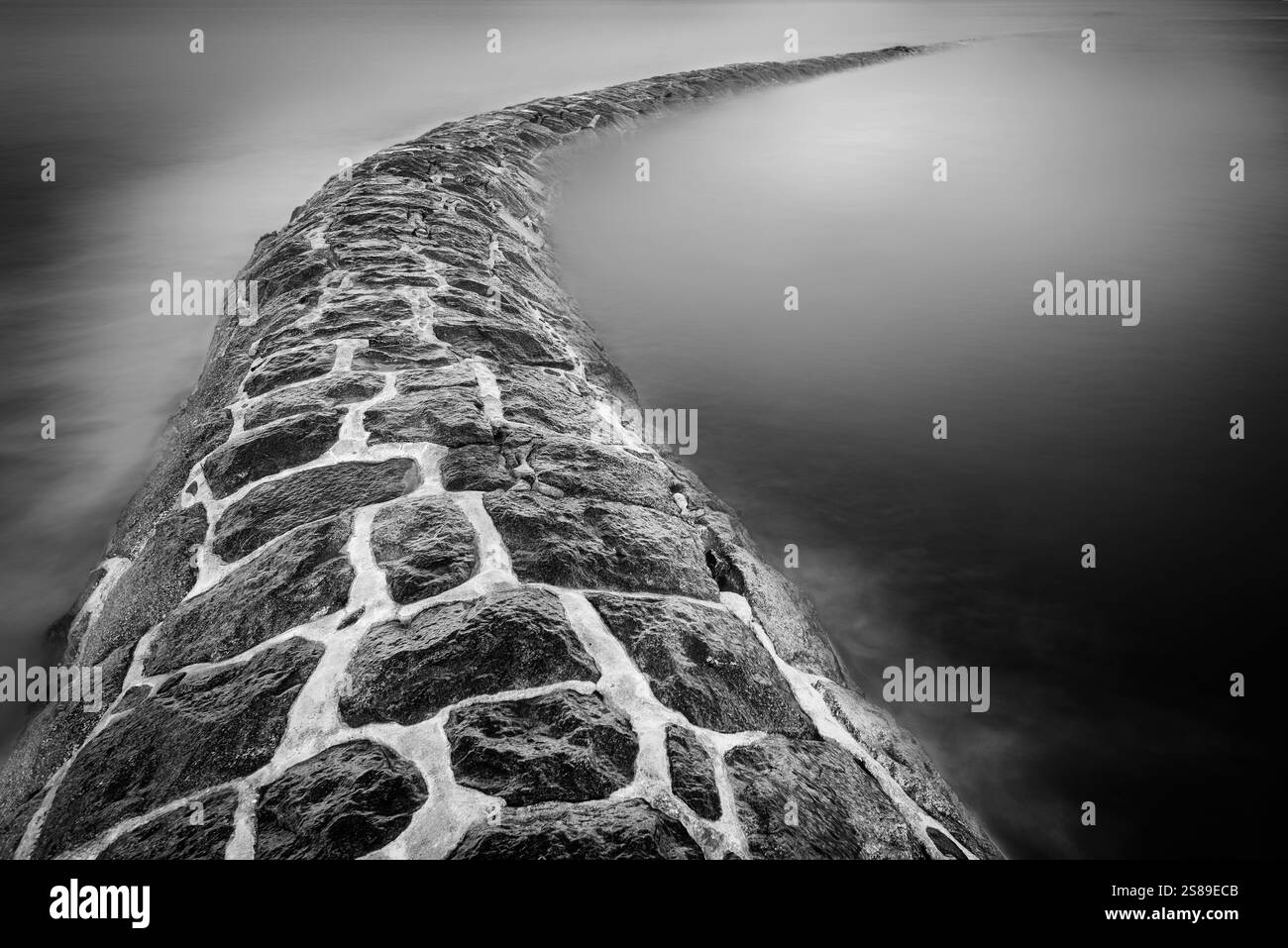 Old, unused, stone outfall pipe for discharge of waste water into the ...