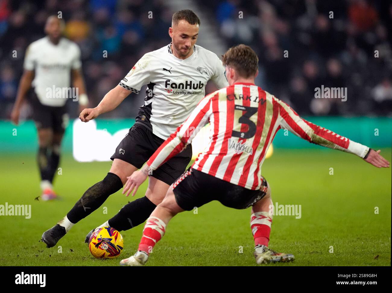 Derby County's Kane Wilson and Sunderland's Dennis Cirkin battle for