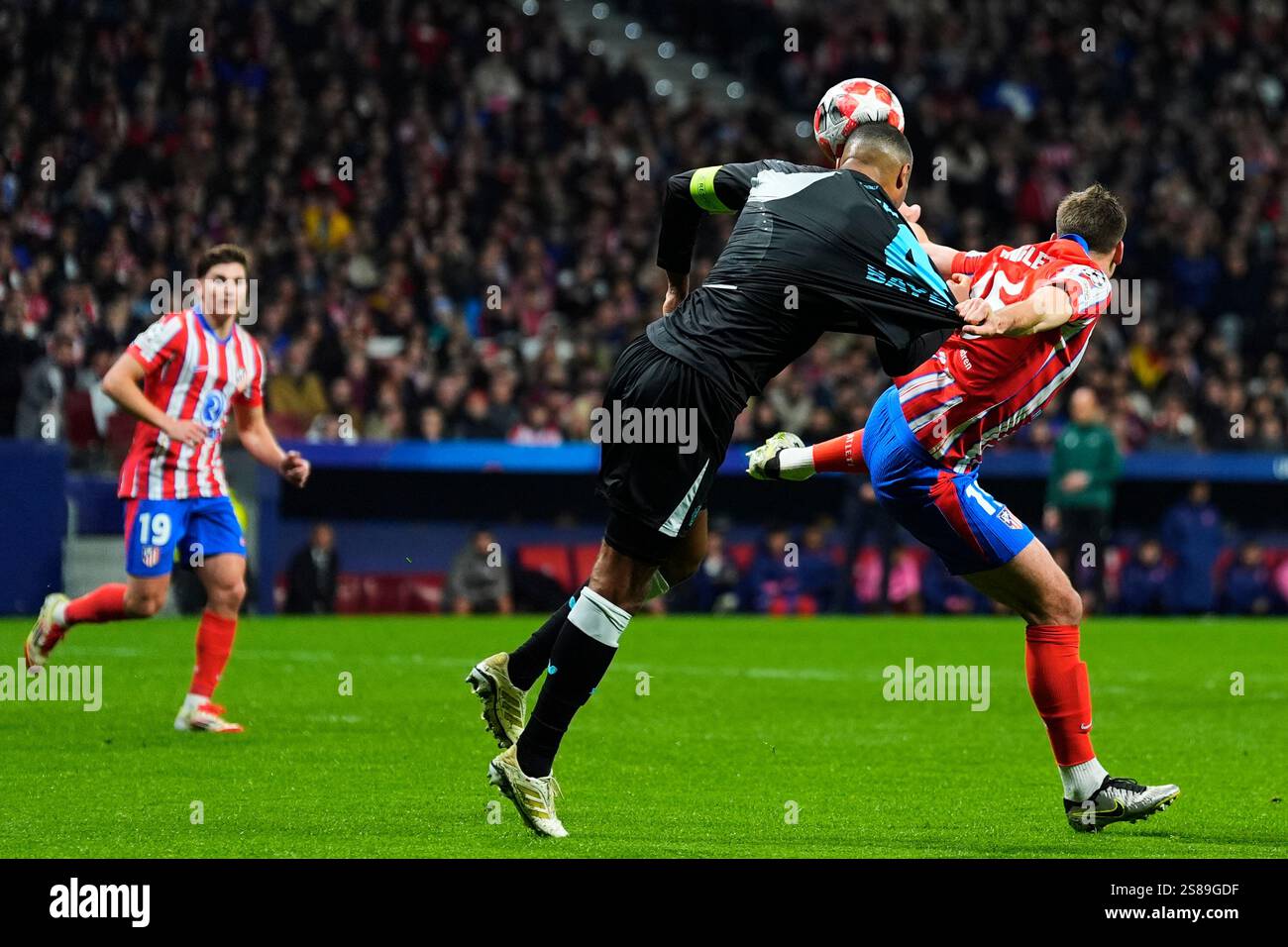 Jonathan Tah of Bayer Leverkusen and Clement Lenglet of Atletico de ...