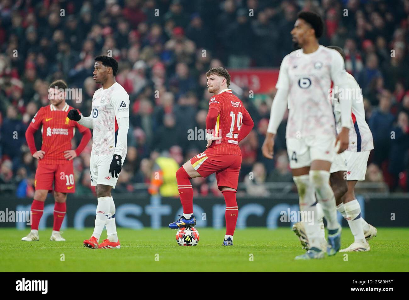 Liverpool's Harvey Elliott (centre) reacts after Lille's Jonathan David